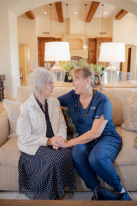 Caregiver from Total Care Connections having a warm conversation with a senior client.