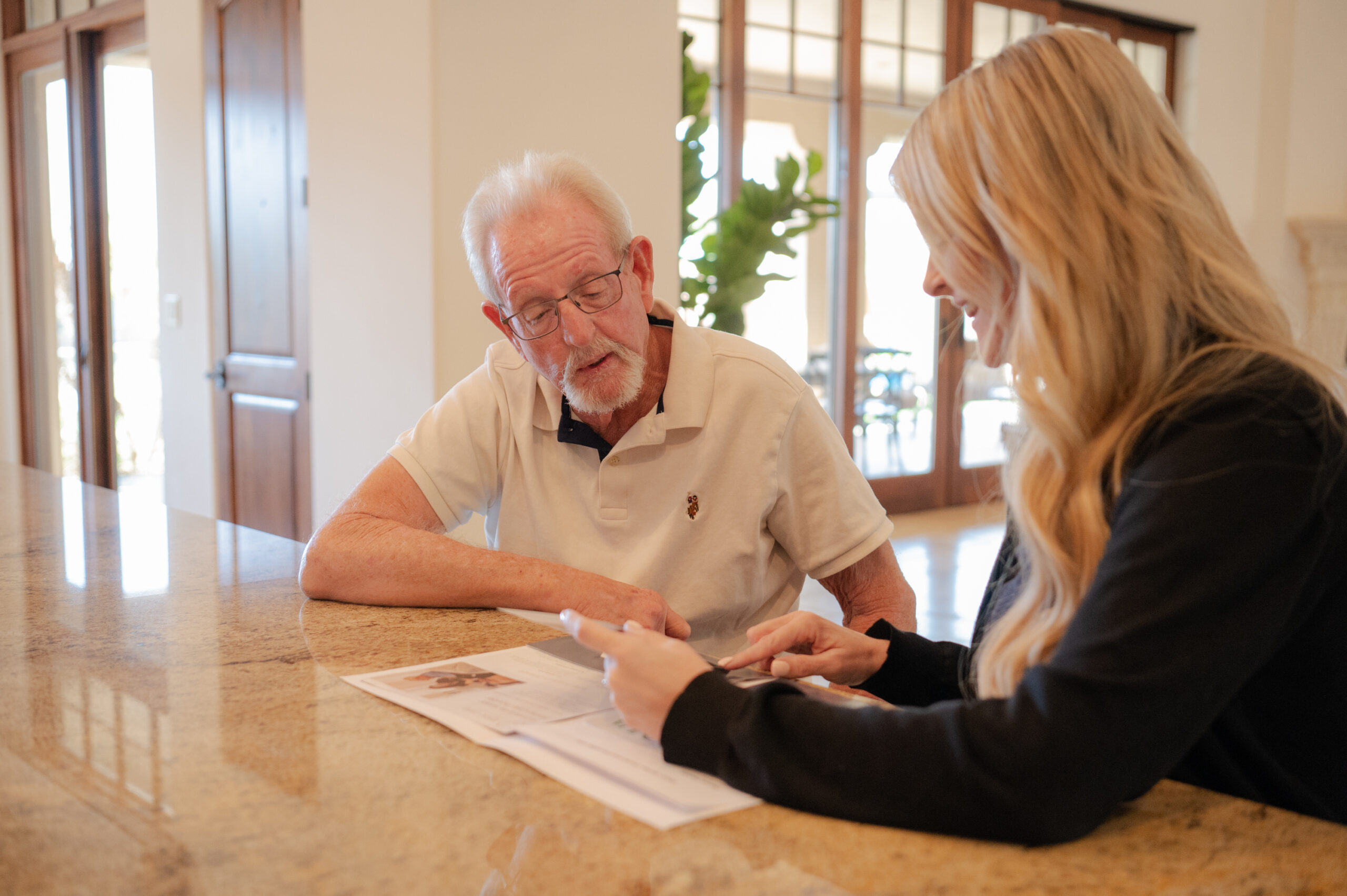 Caregiver from Total Care Connections having a warm conversation with a senior client.